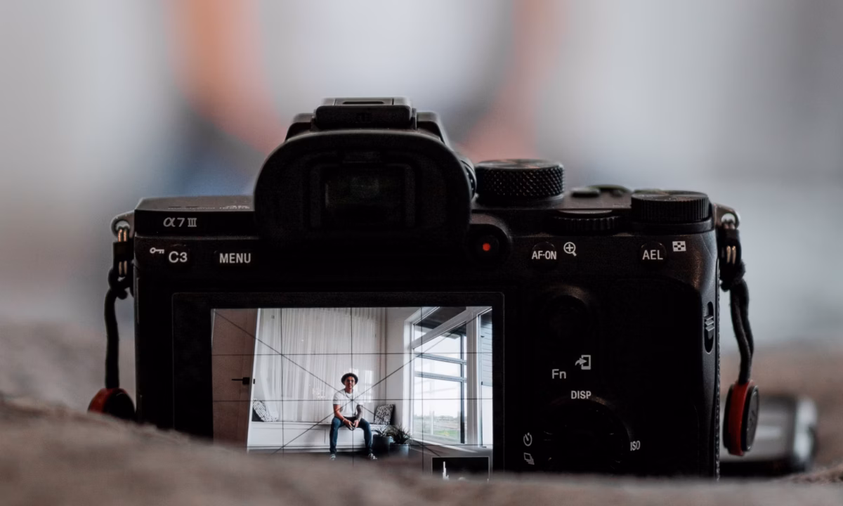 image of camera pointing at real estate agent as example of real estate content marketing