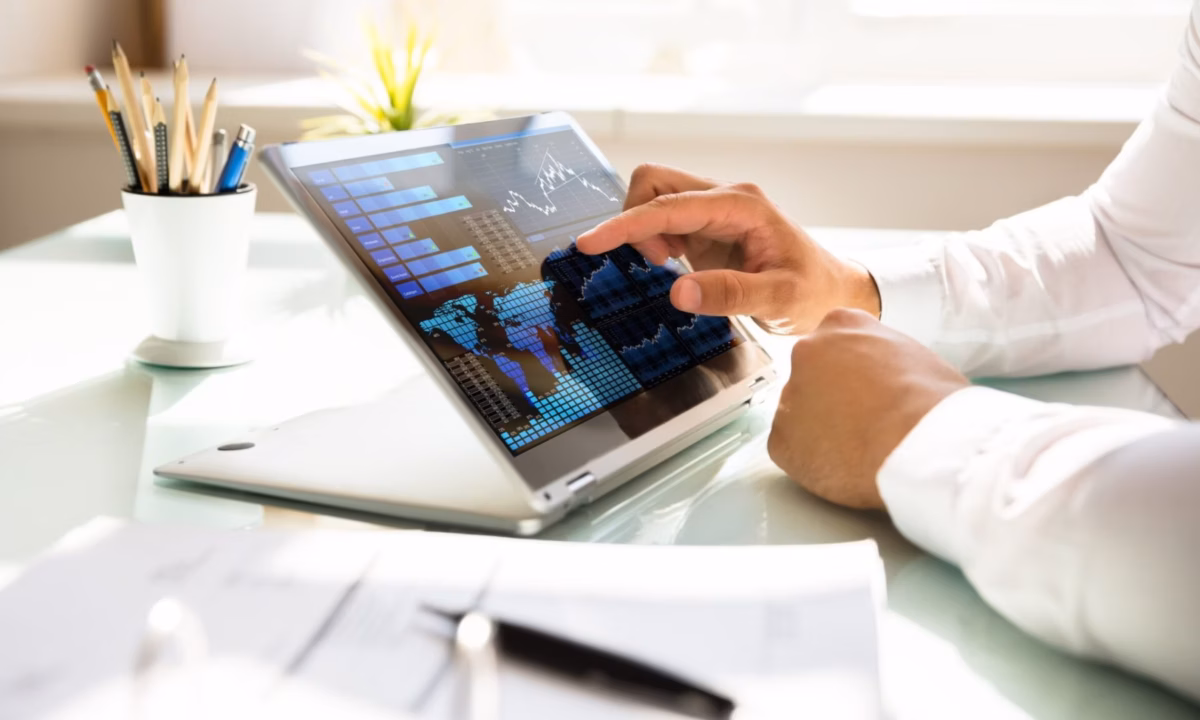 A realtor checks his website's blog analytics on his tablet.