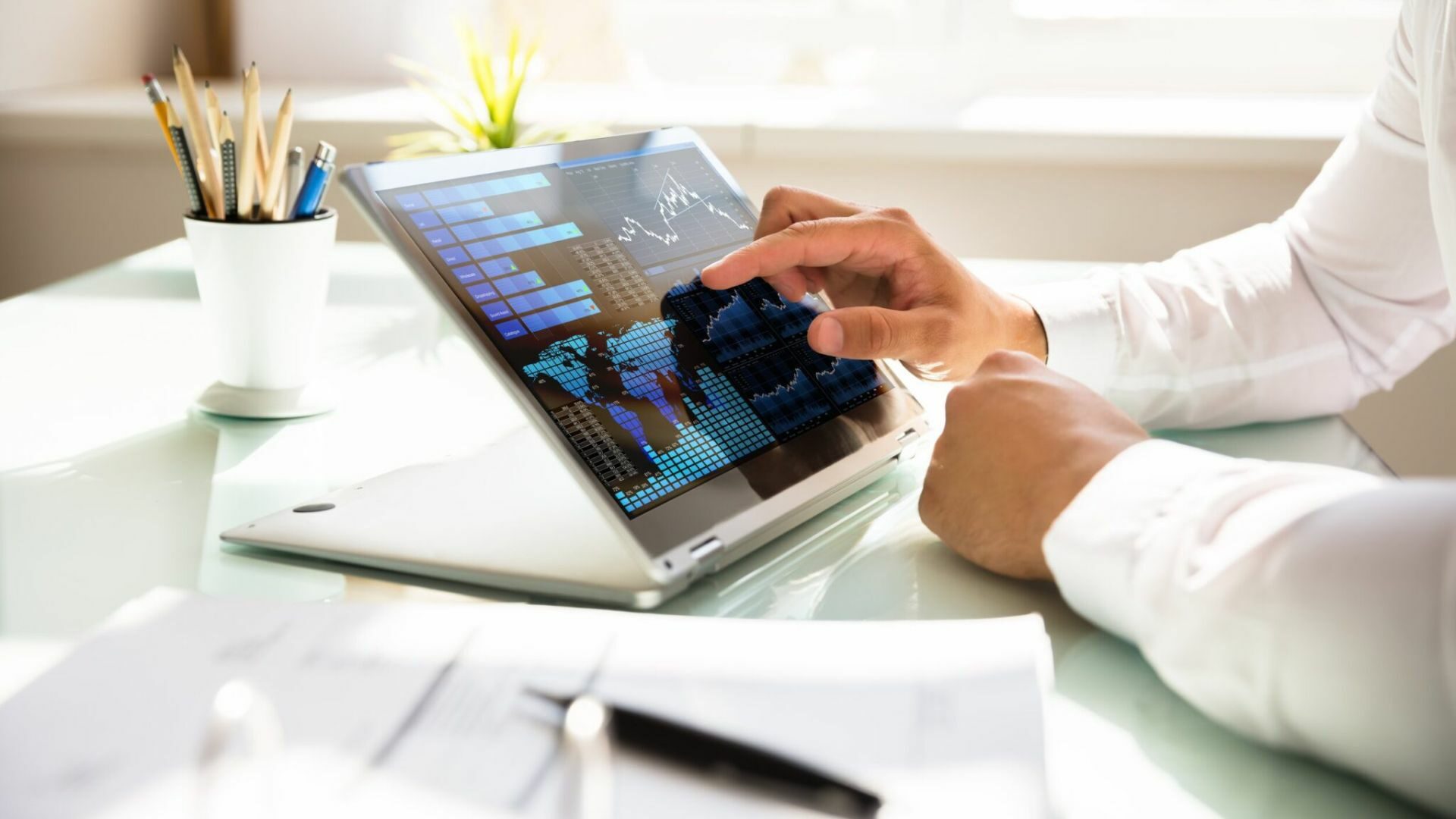 A realtor checks his website's blog analytics on his tablet.