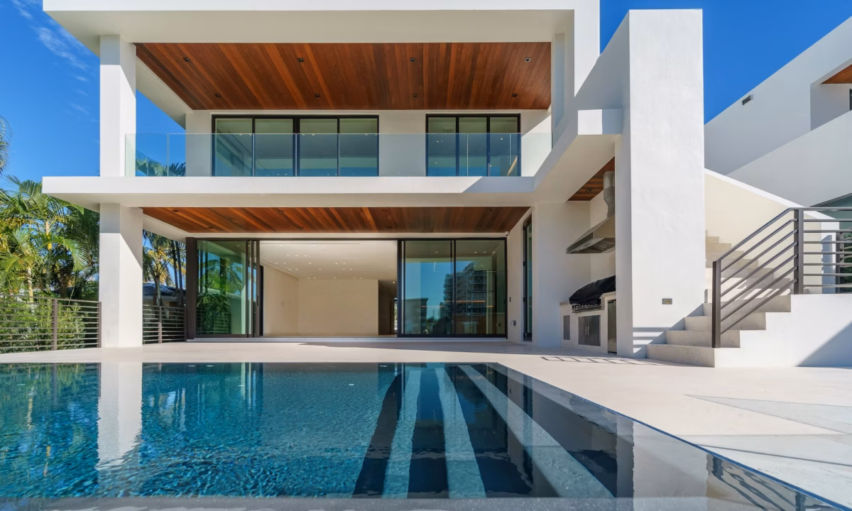 A view from the pool of a high-end luxury home, typical of imagery used to generate real estate listing leads