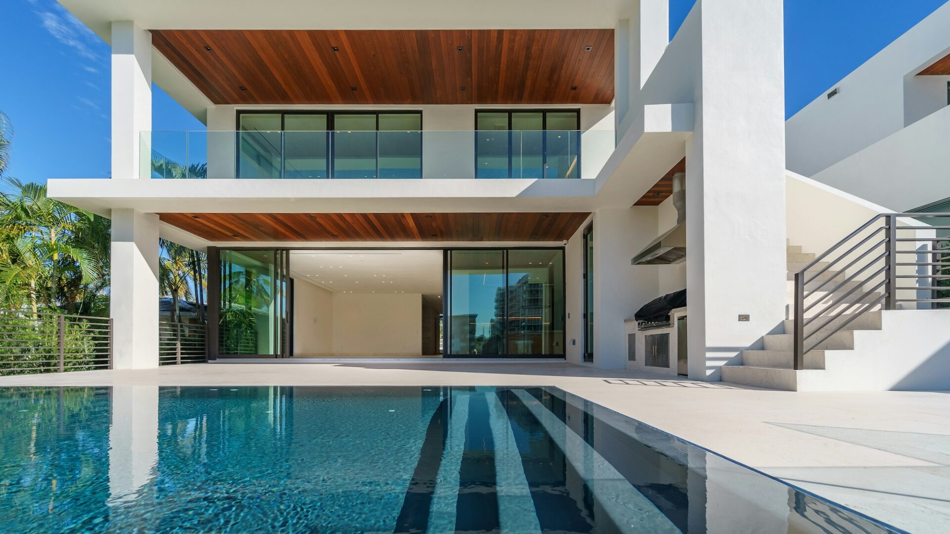A view from the pool of a high-end luxury home, typical of imagery used to generate real estate listing leads