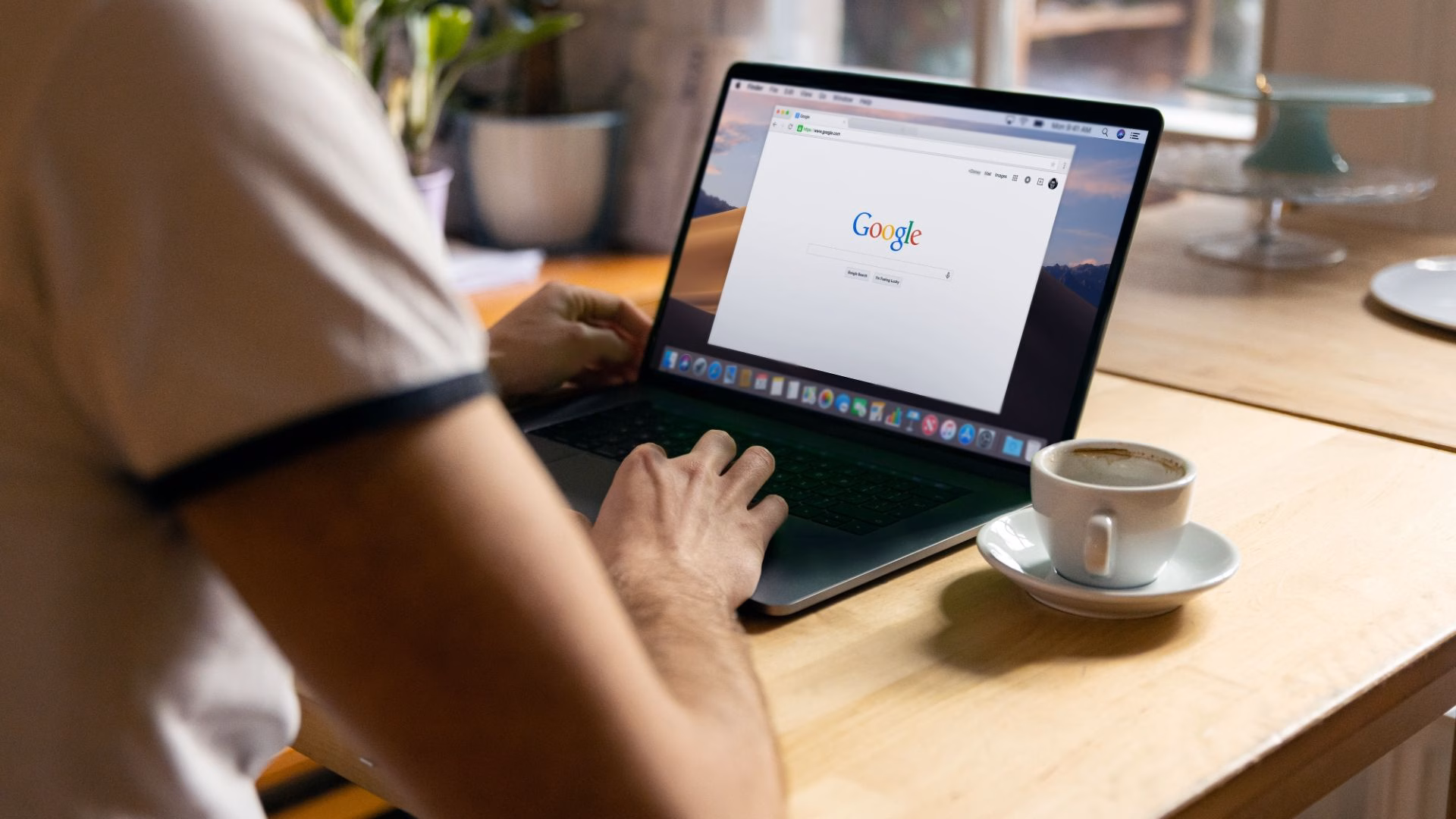 A realtor searches Google on his laptop to learn more about boosting his website's SEO value.