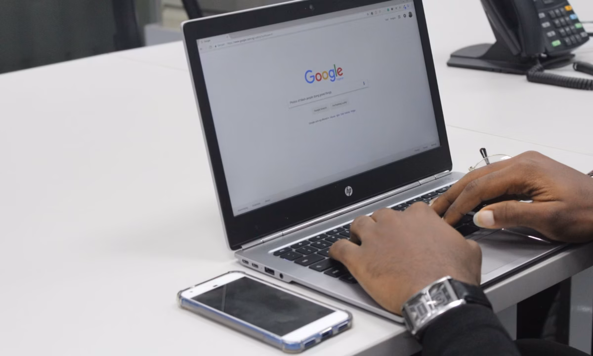 A realtor searches Google on his laptop to learn more about landing pages.