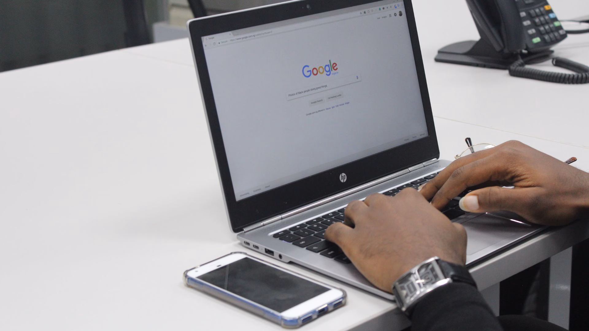 A realtor searches Google on his laptop to learn more about landing pages.