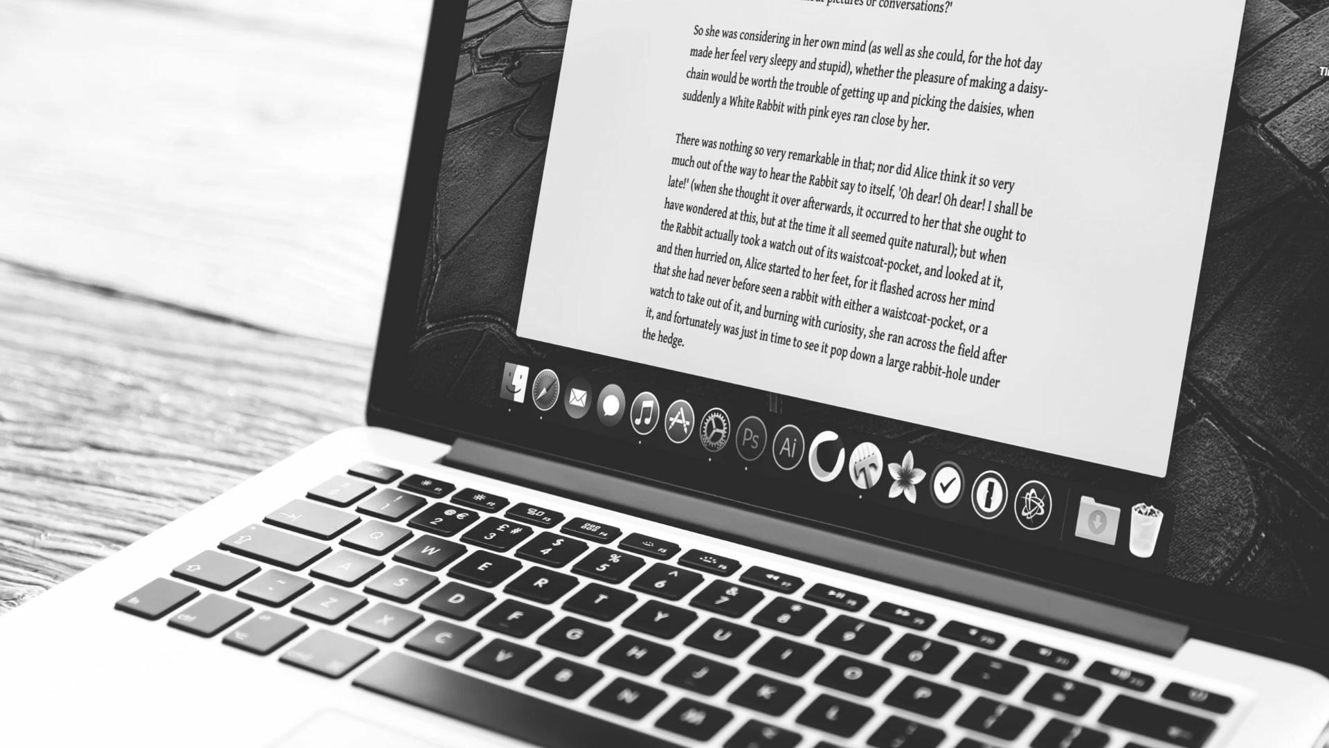 A MacBook showing real estate blog posts