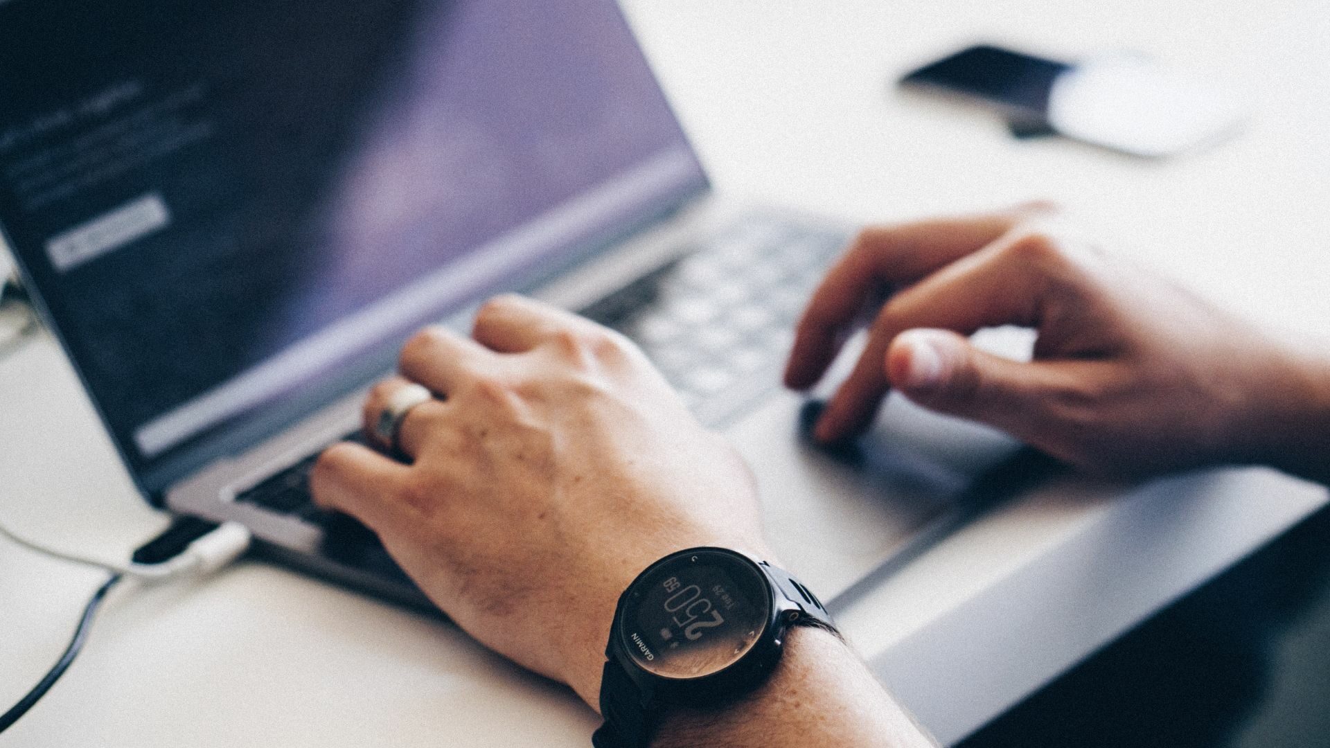 A realtor sits in front of his laptop, preparing for the new age of marketing in 2021.