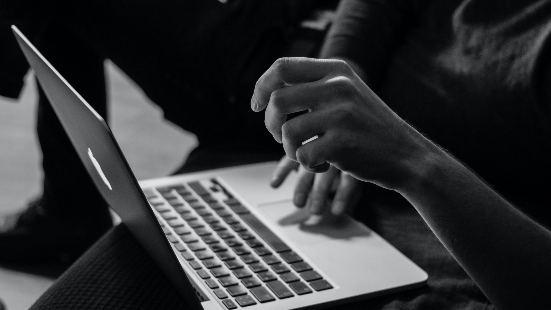 hands typing on laptop for blog about how to host a virtual open house