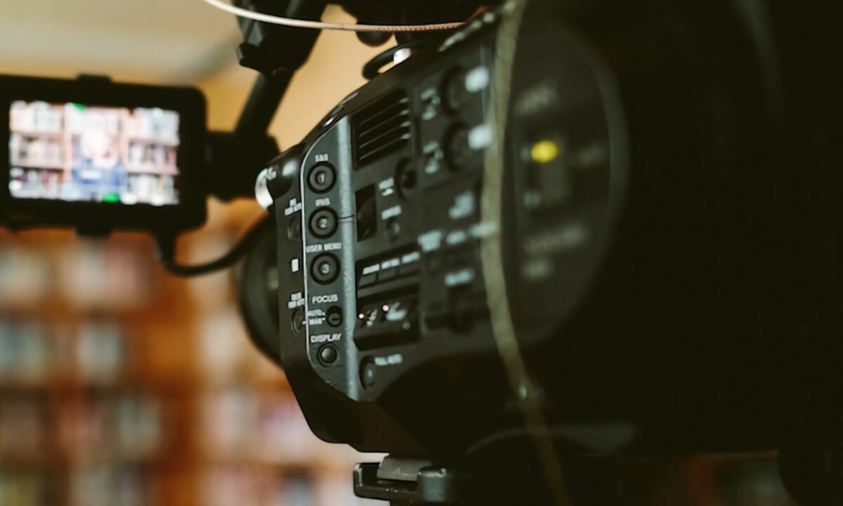 A professional camera behind the scenes shoots free stock videos.