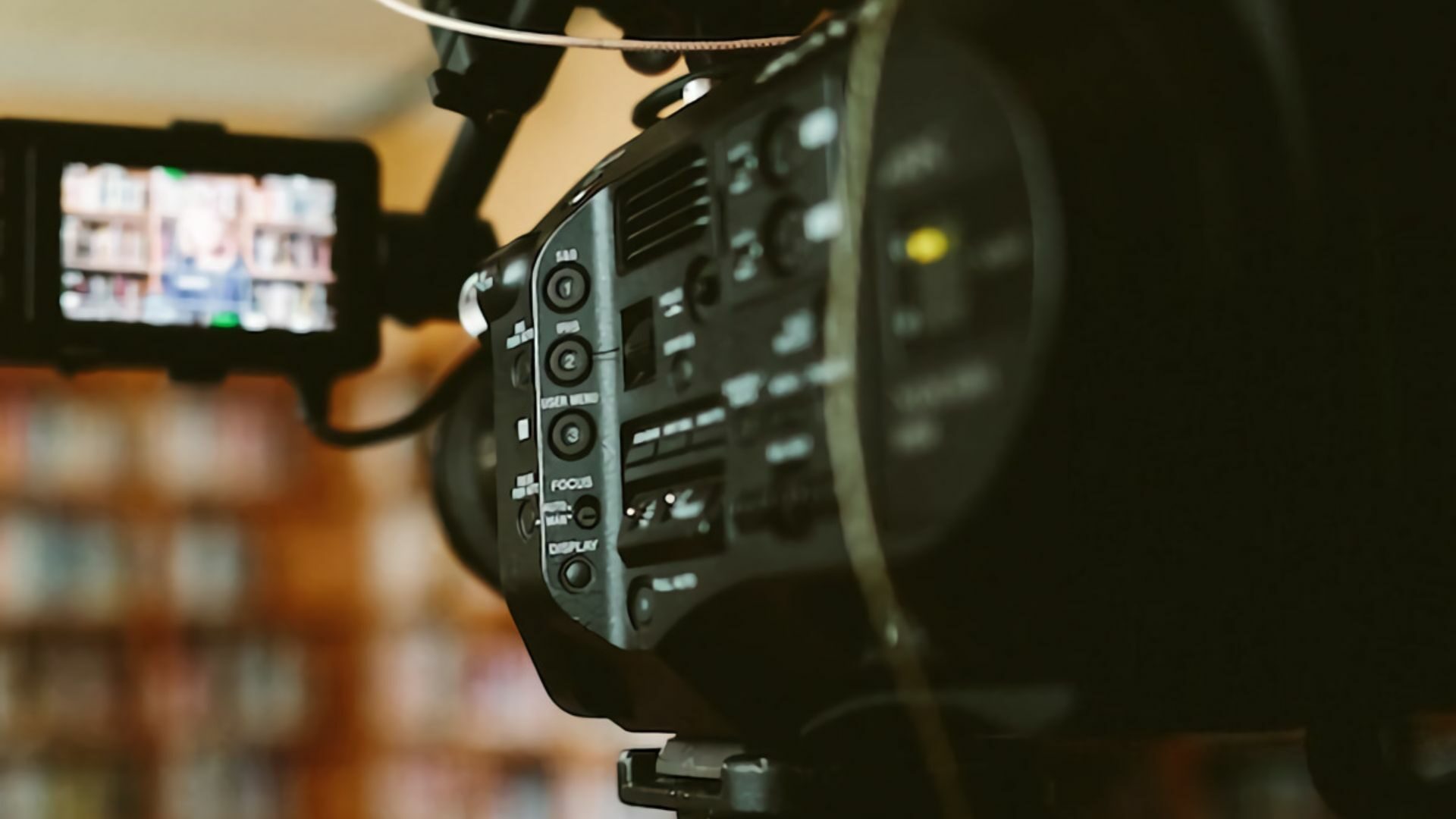 A professional camera behind the scenes shoots free stock videos.
