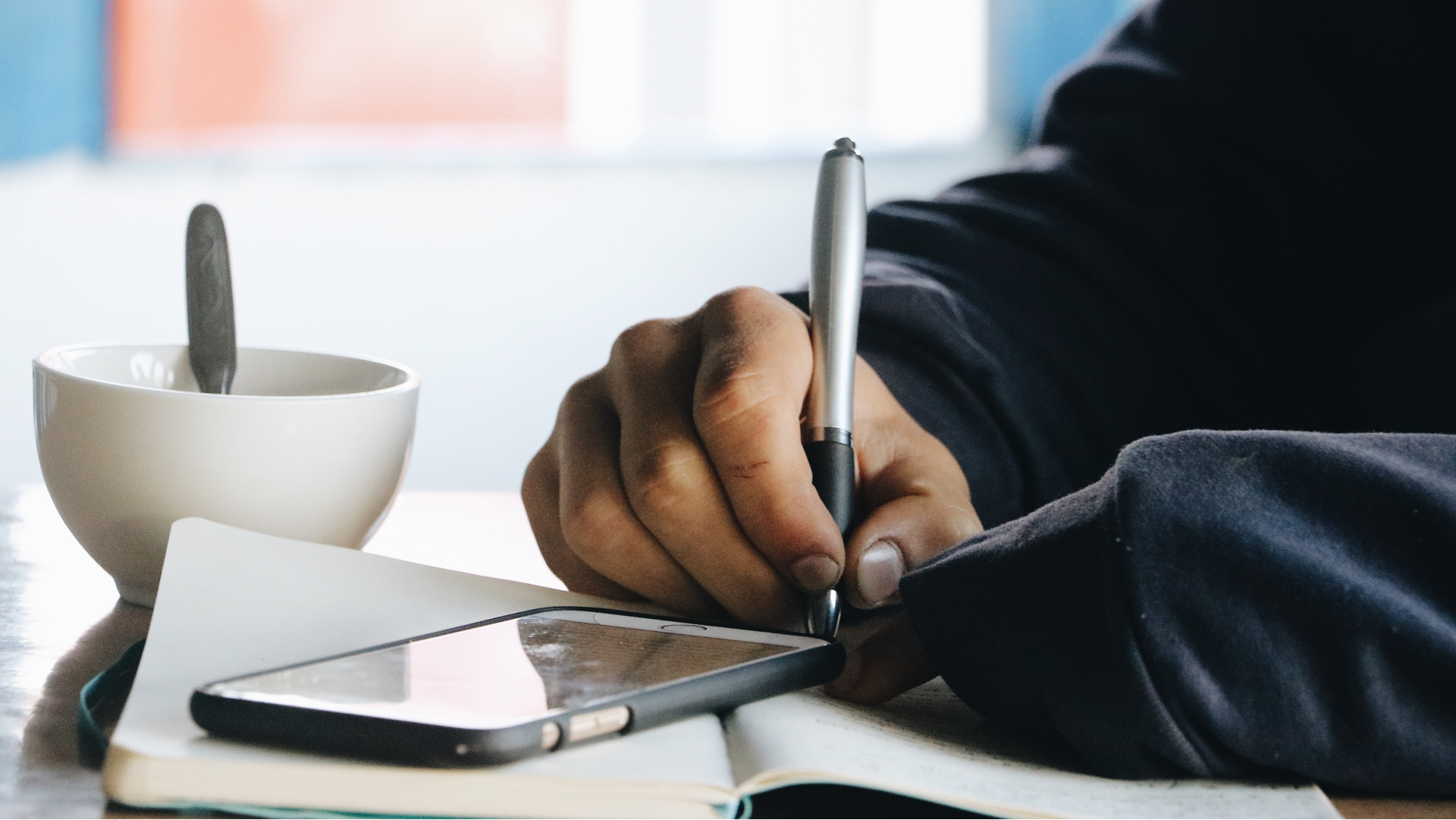agent sitting at desk taking notes