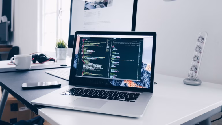 A laptop showing a website's backend, full of codes for pop-ups