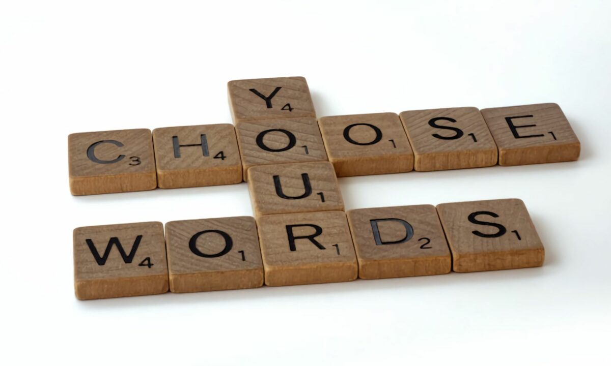 A Scrabble tile forming a keyword: Choose Your Words.