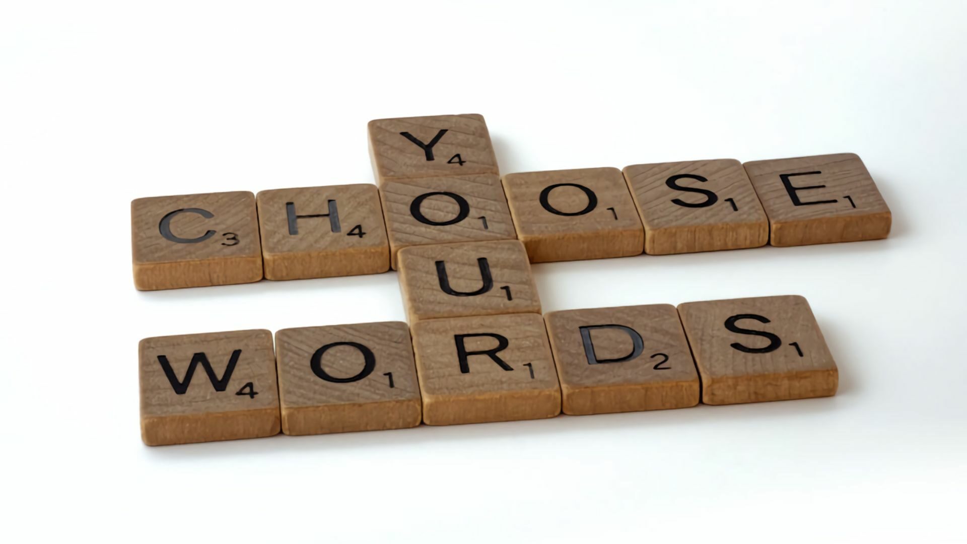 A Scrabble tile forming a keyword: Choose Your Words.