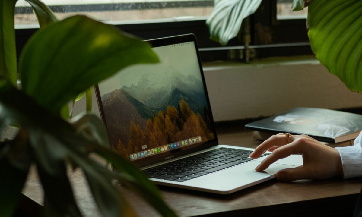 A realtor in front of her laptop has just begun searching online for a comparison of Facebook vs. Google Ads.