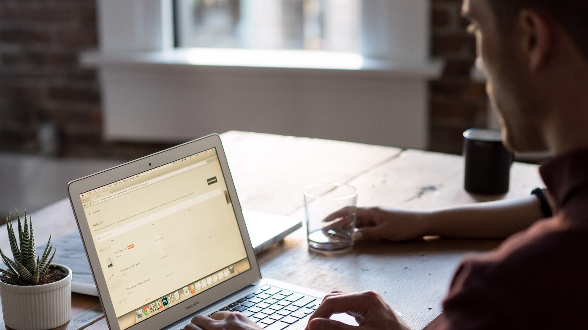 A real estate agent searches online for the best domain name for his website.