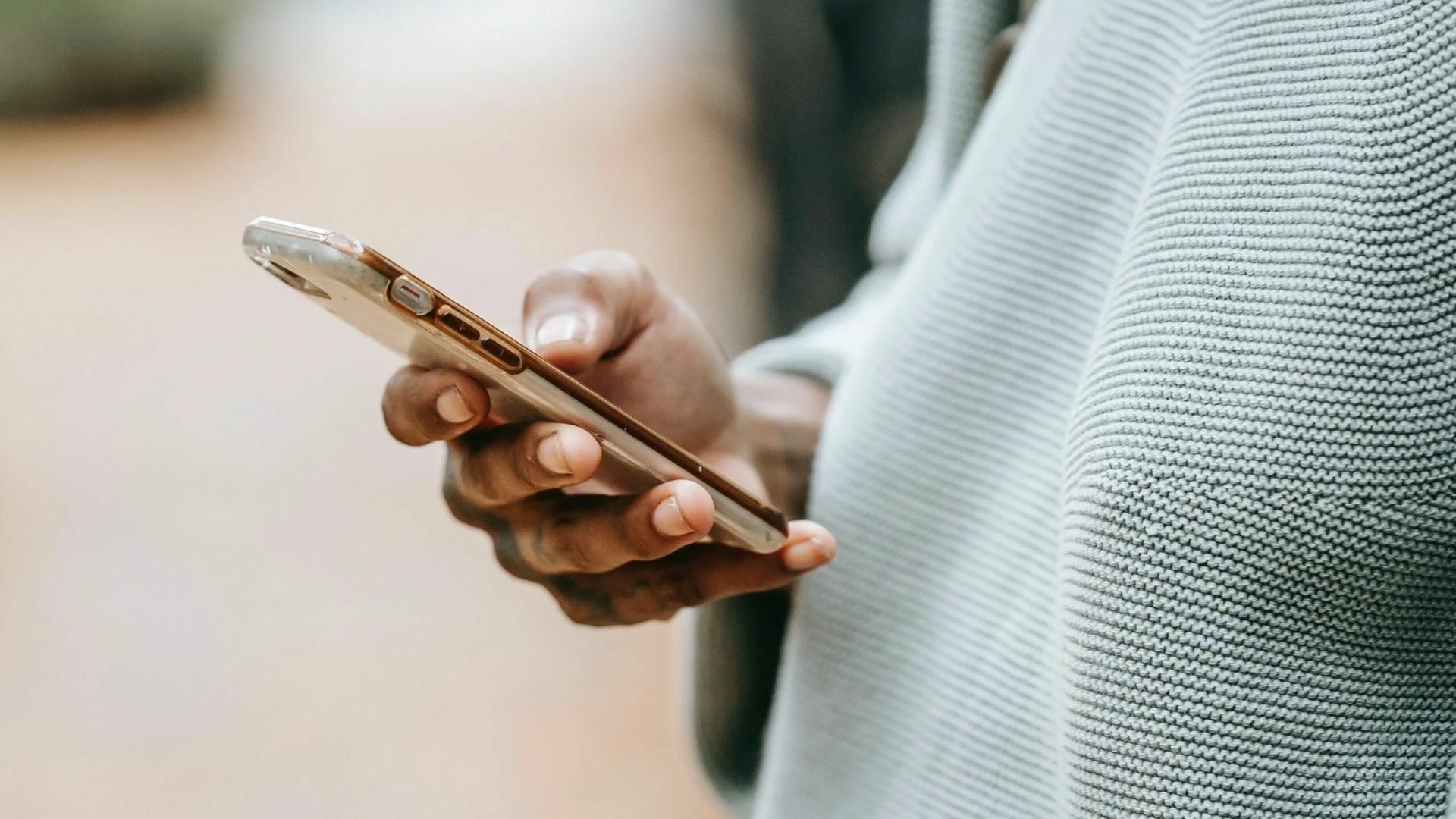 A customer is looking through his phone.