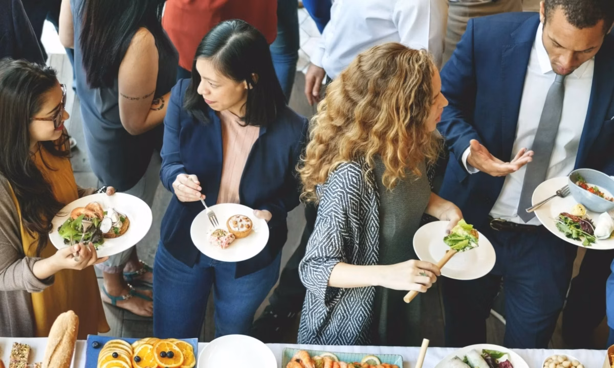 A group of real estate agents socializing in the community through a public event.