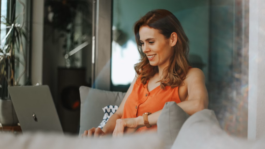 real estate agent using laptop looking up real estate marketing automation solutions