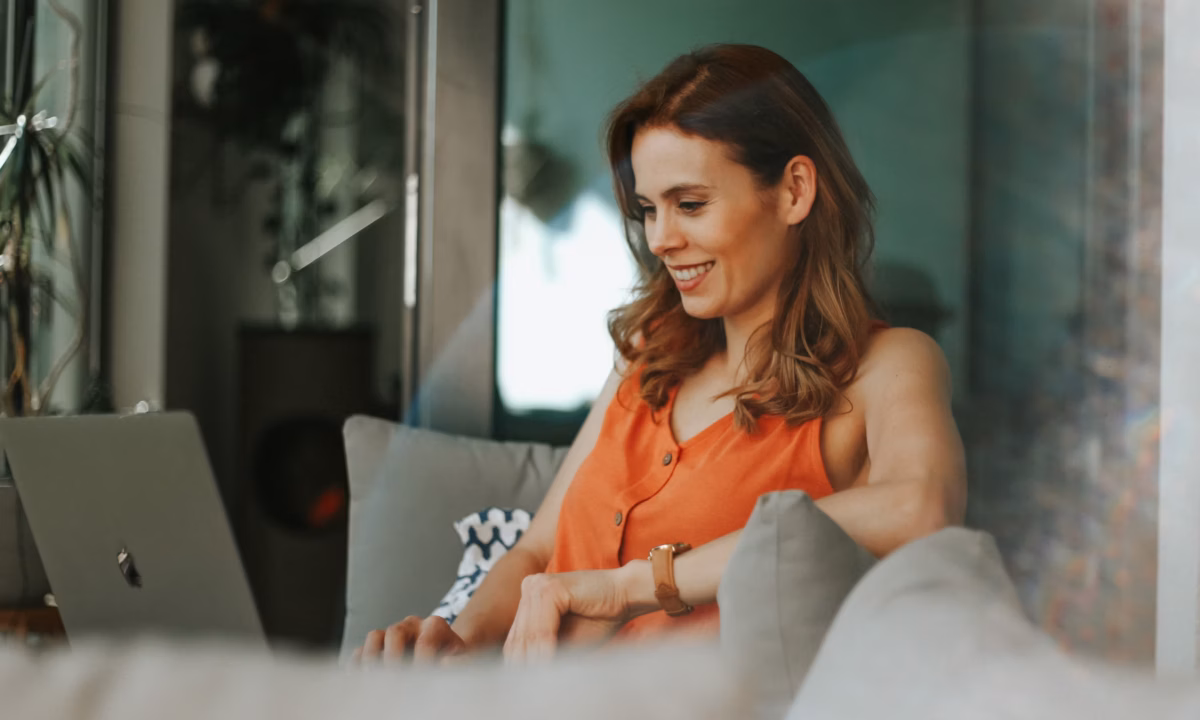real estate agent using laptop looking up real estate marketing automation solutions