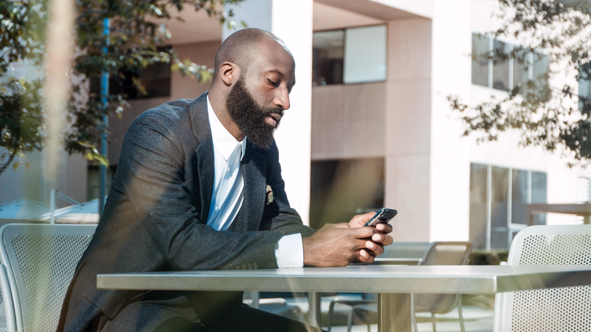 real estate agents looking up top real estate apps on his phone