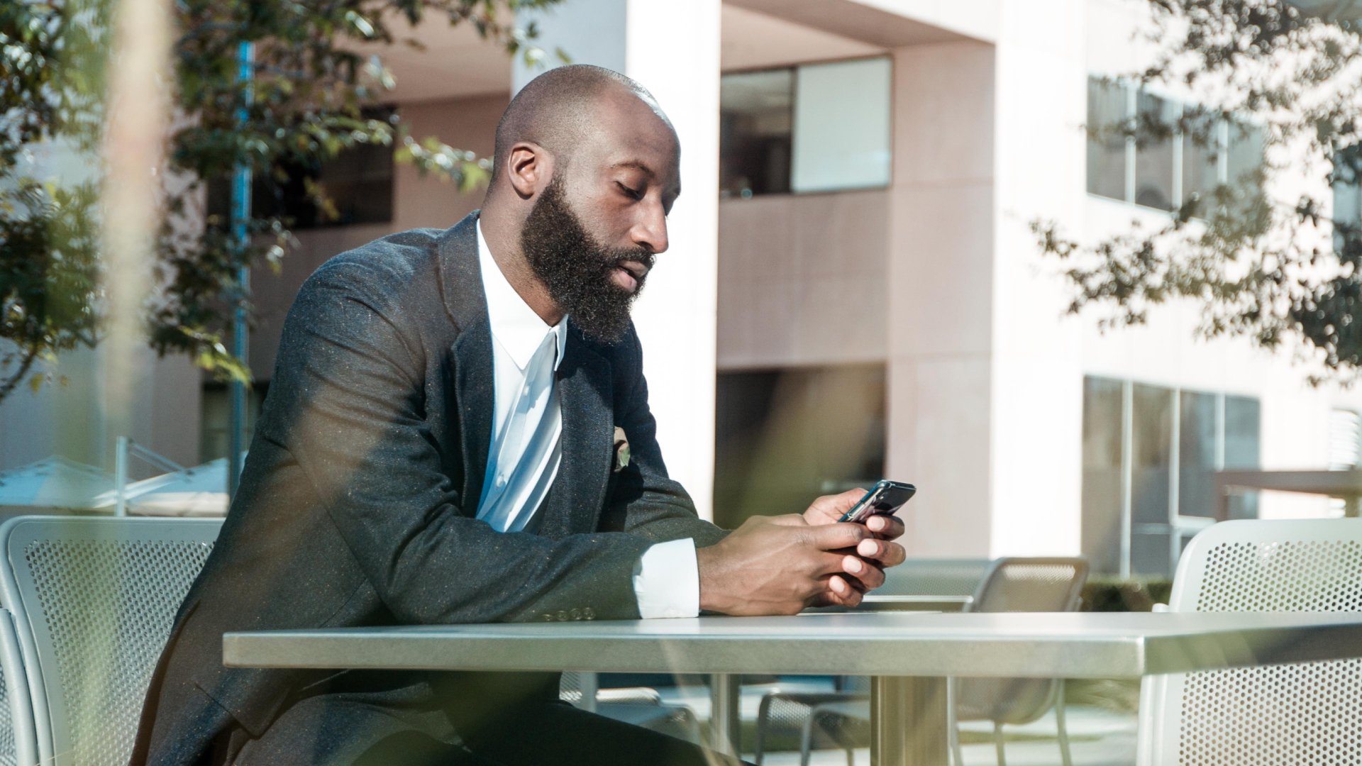 real estate agents looking up top real estate apps on his phone