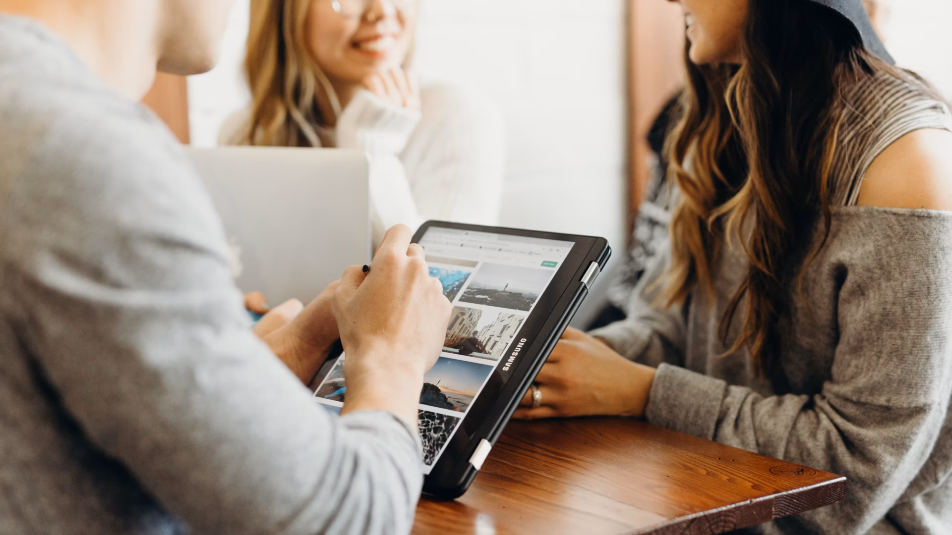 A group of agents collaborate and brainstorm ideas for the best real estate website design.