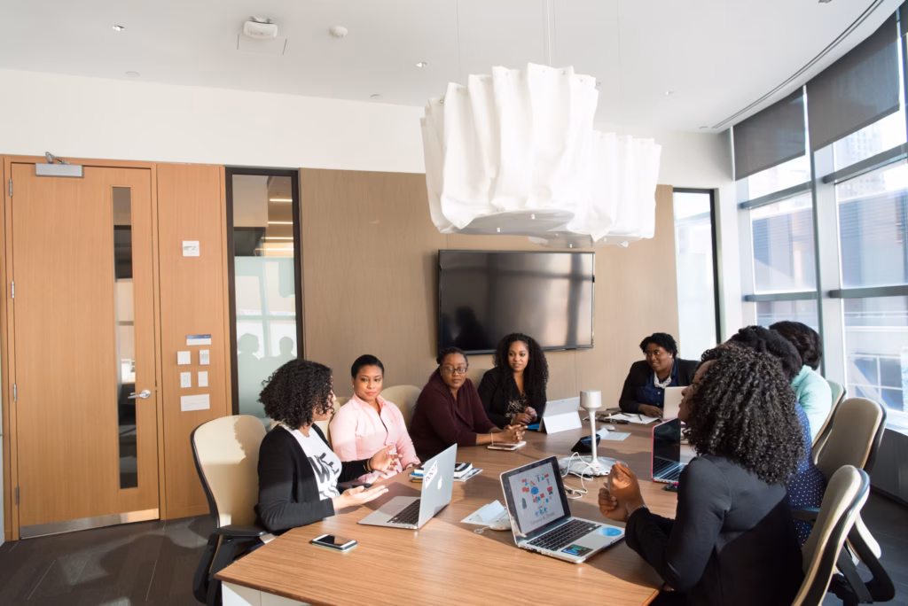 A team of realtors is shown collaborating and brainstorming strategies to grow your audience and reach more potential clients.