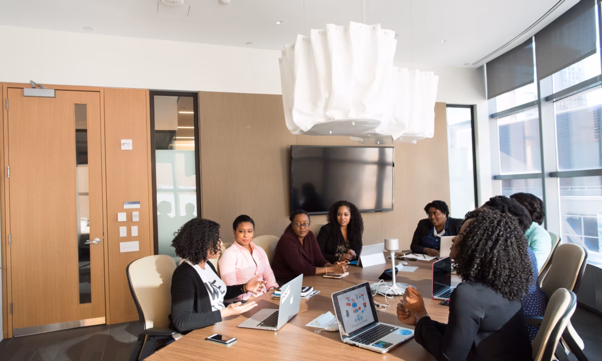 A team of realtors is shown collaborating and brainstorming strategies to grow your audience and reach more potential clients.