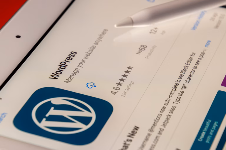 A tablet displays a preview of a real estate website built on WordPress CMS.