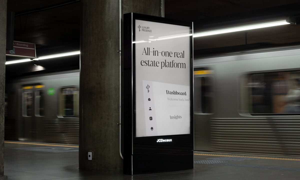 A mockup of a Luxury Presence poster in a train station used for rebranding purposes.