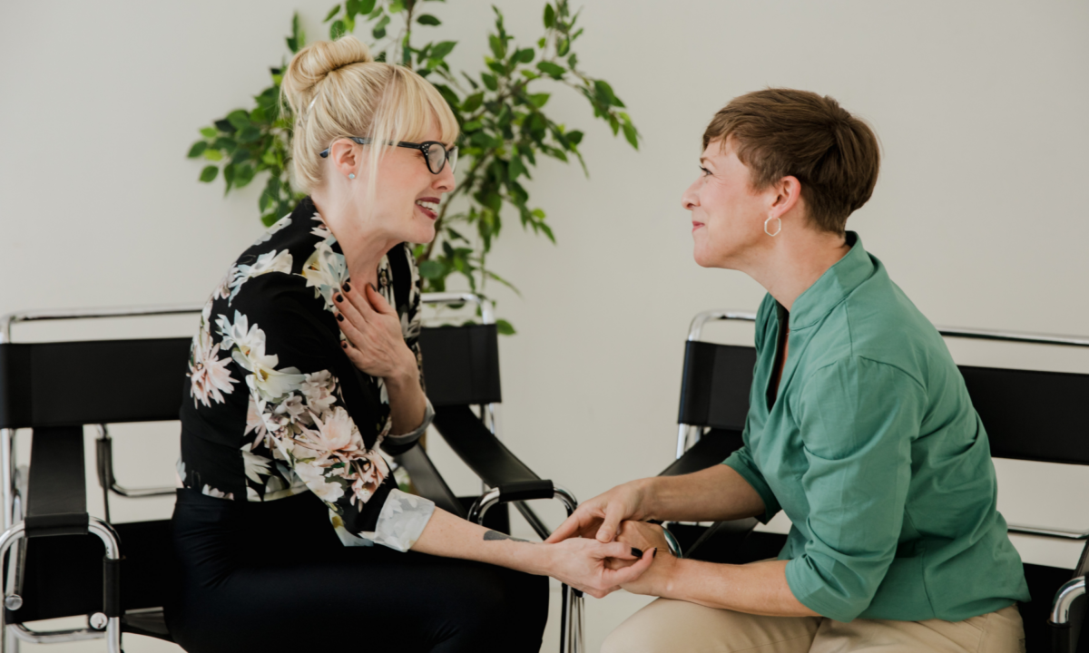 A real estate mentor sitting with her mentee to provide advice and guidance