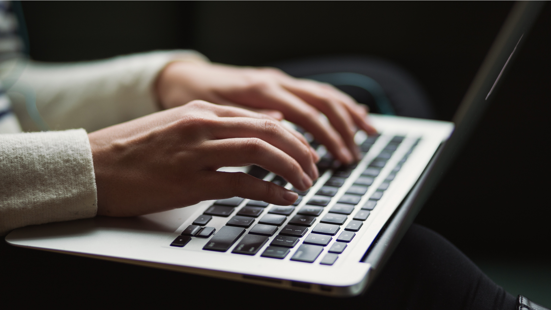 image on hands typing on a laptop