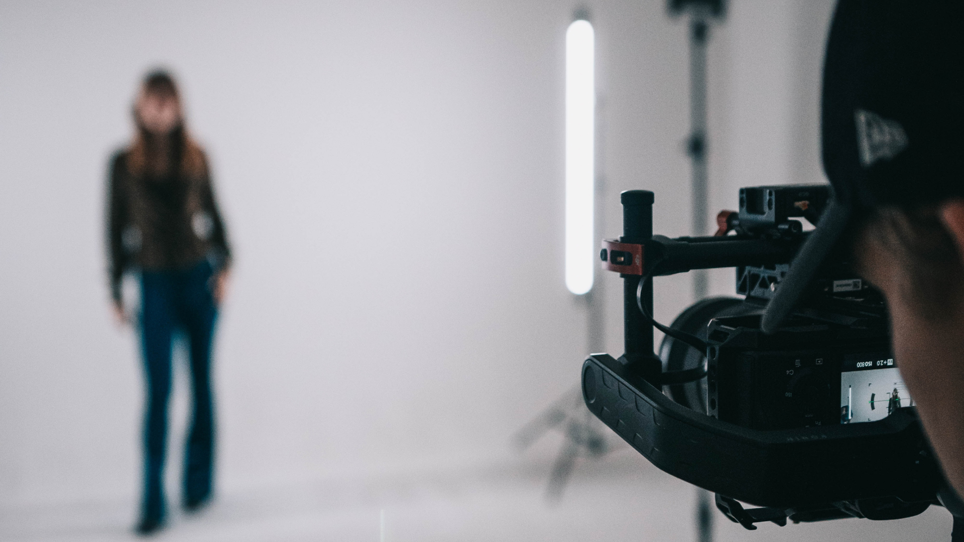 image of a real estate agent posing in front of a camera to help with her real estate video marketing efforts