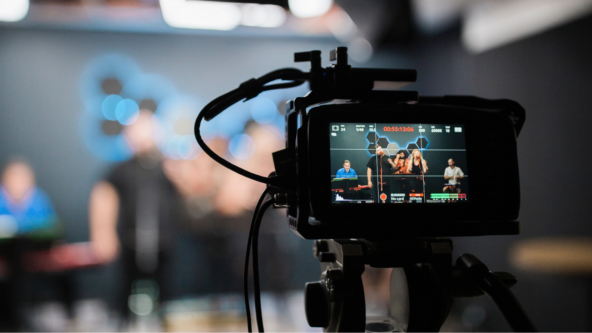 image of video camera pointing at show hosts