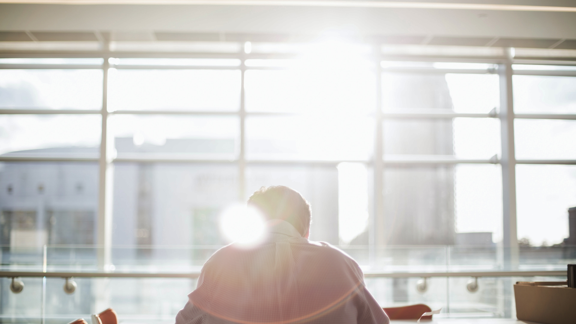 image of a real estate agent sitting at table working for blog post about real estate quotes
