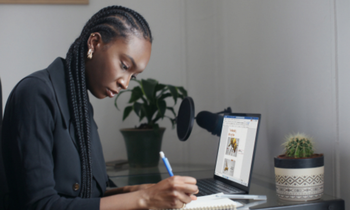 real estate agent creating real estate listing presentation on laptop