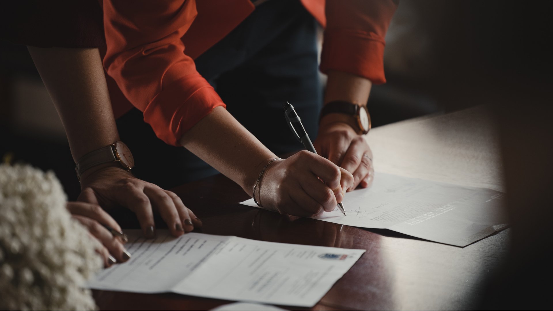 real estate agent reviewing material on how to become a real estate agent in California