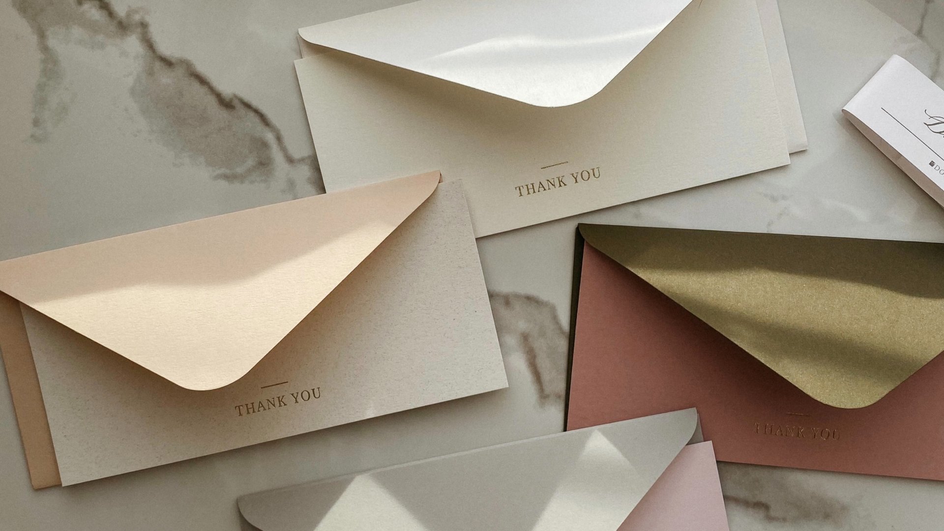 envelopes laid out on marble table