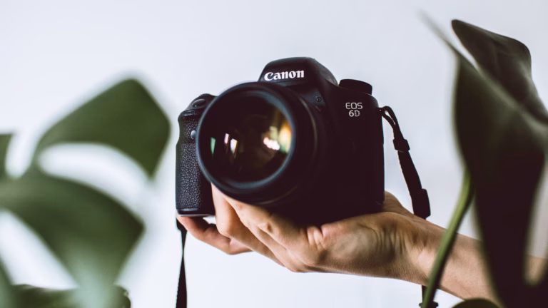 image of photographer holding camera for a blog article about real estate photography pricing