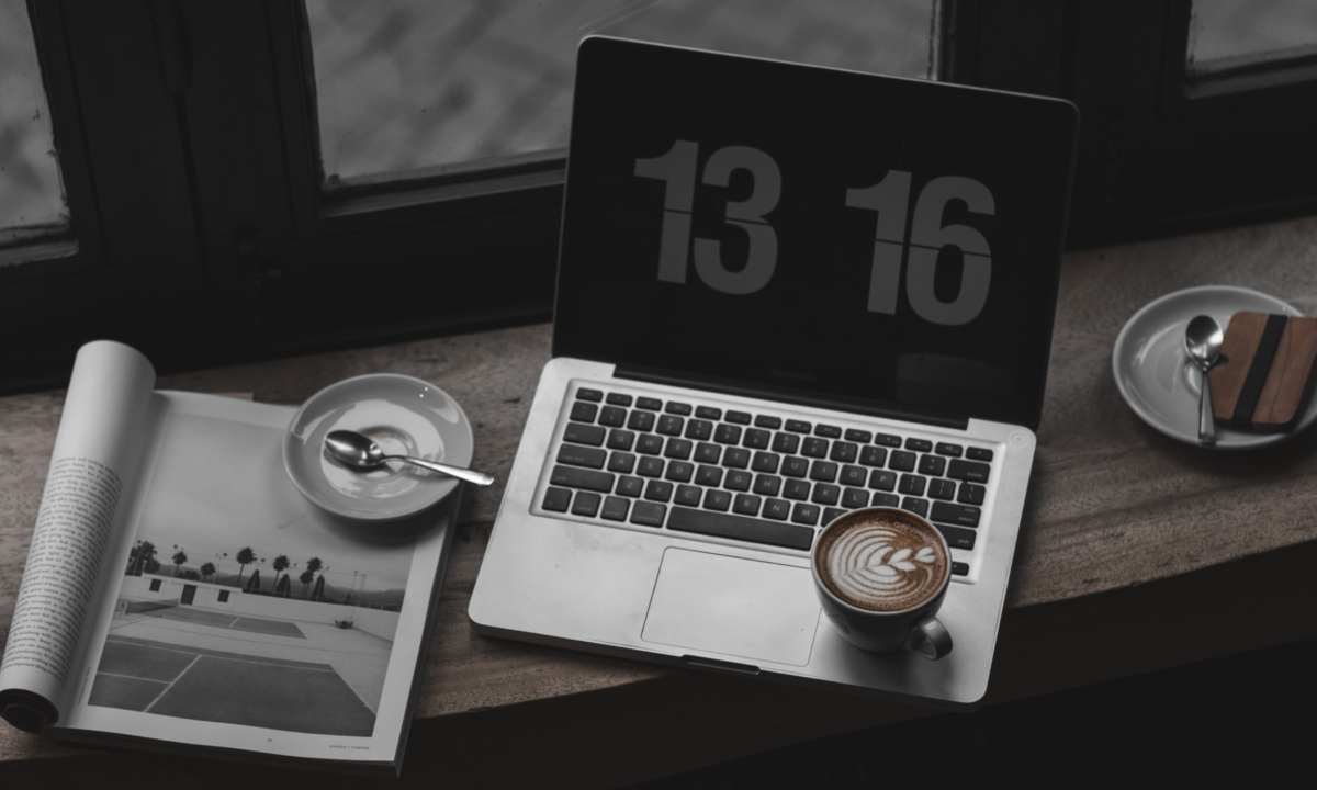 laptop sitting on desk that an agent will use to research the best real estate software