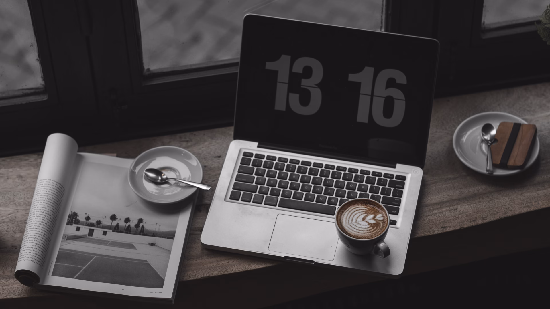 laptop sitting on desk that an agent will use to research the best real estate software