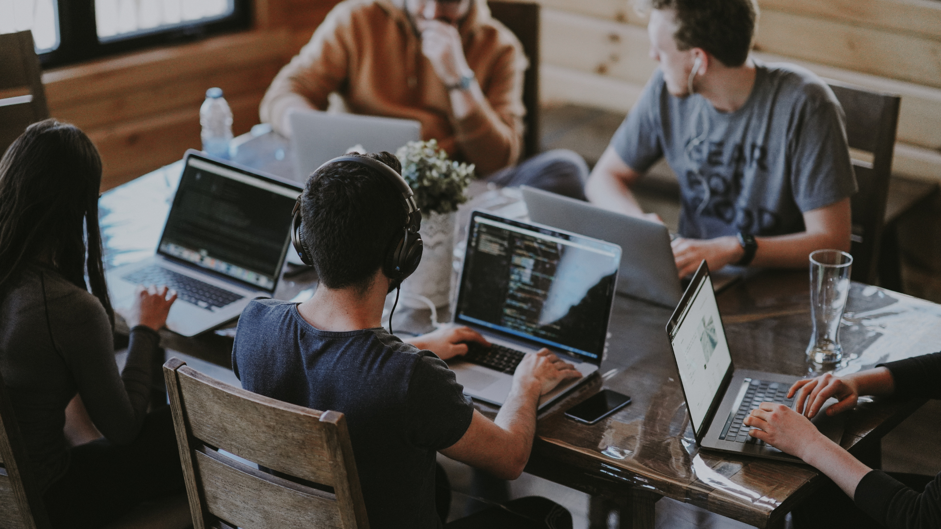 young professional sitting at desk to build a real estate website