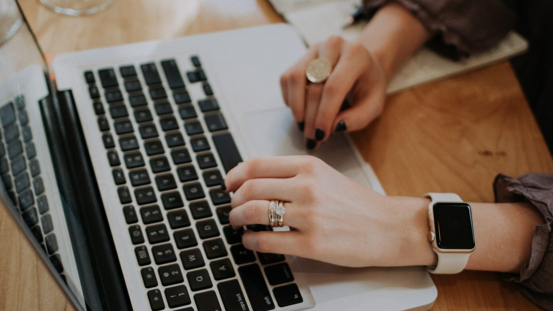 real estate agent typing on laptop for blog about real estate content writing