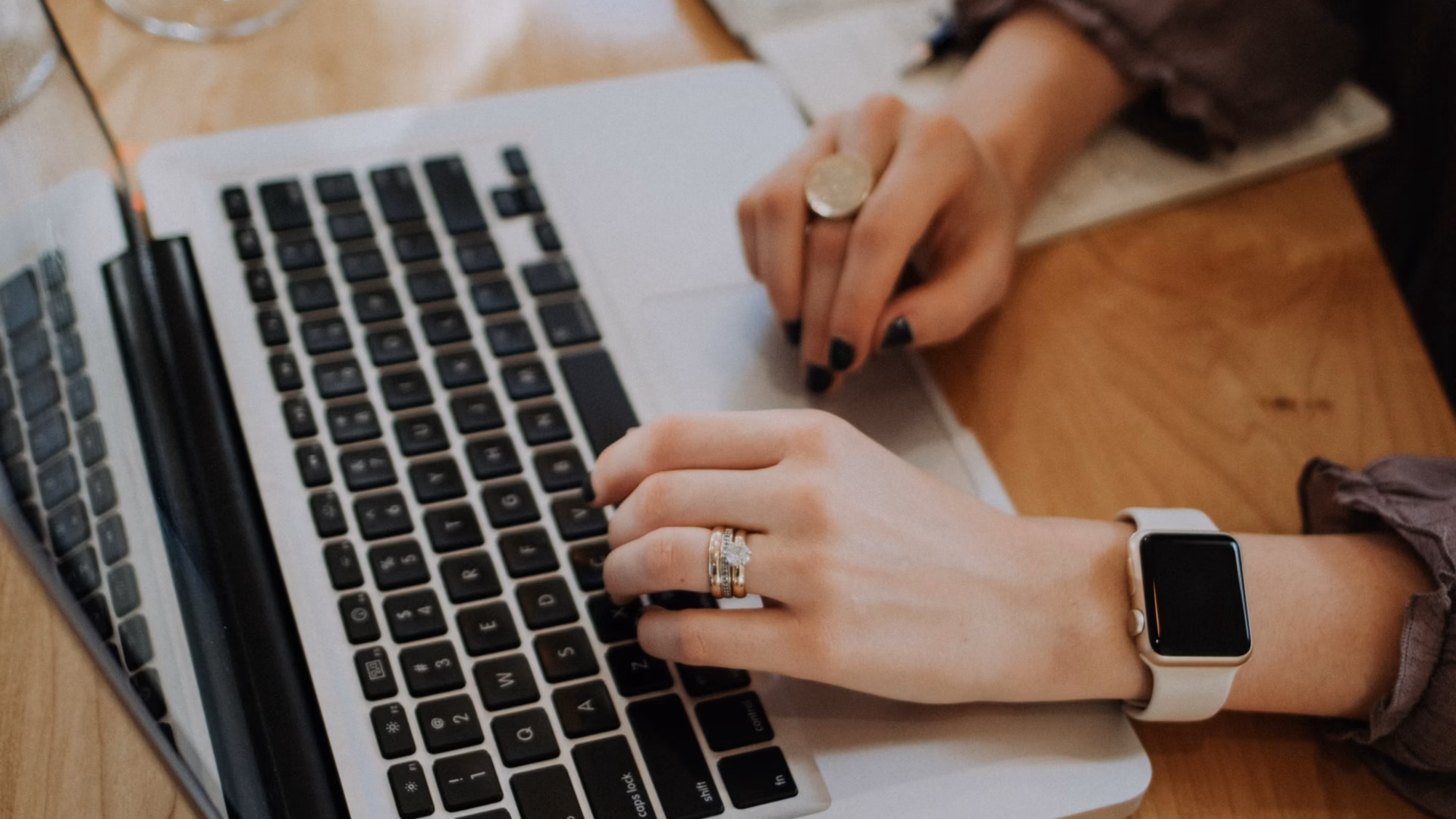 real estate agent typing on laptop for blog about real estate content writing