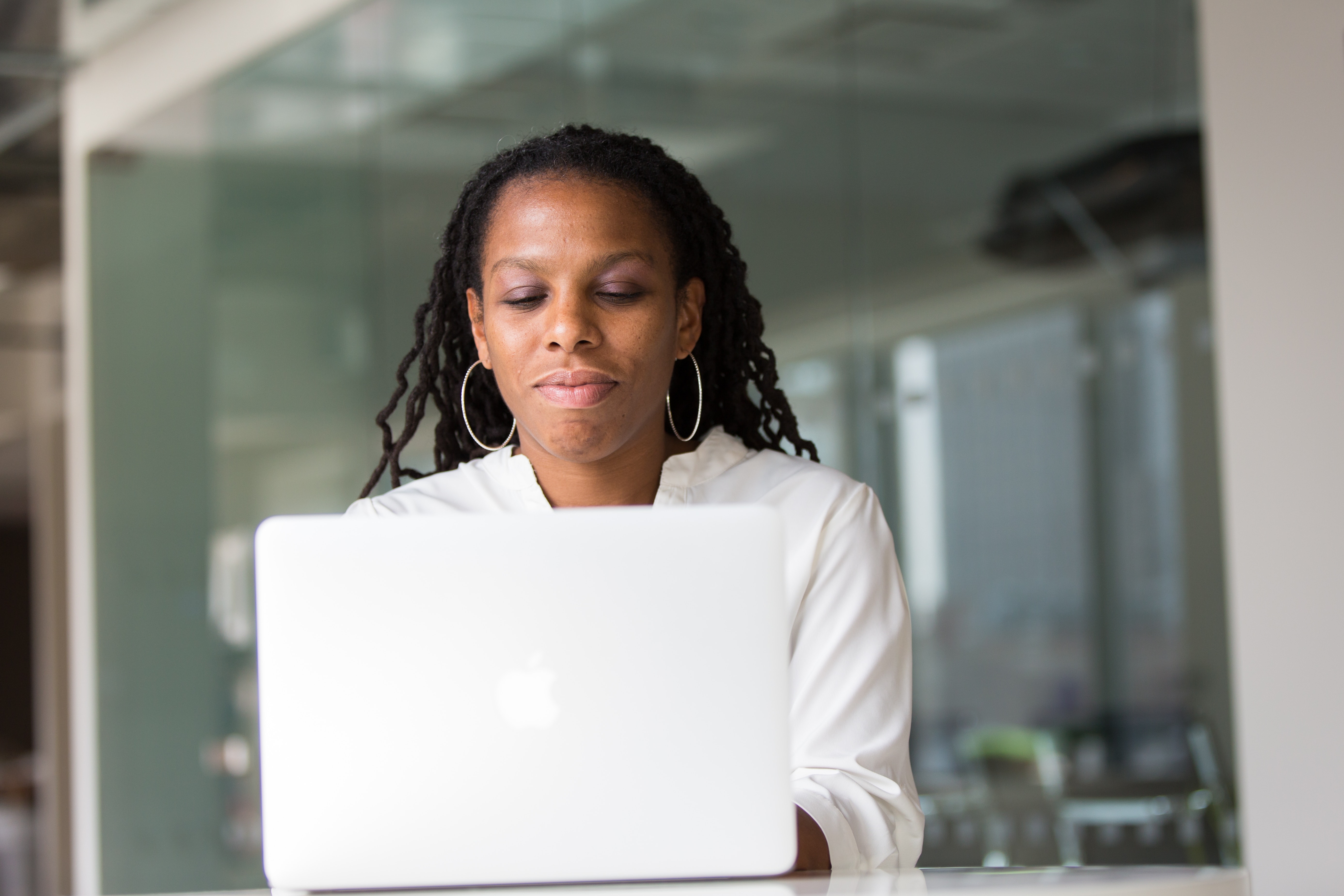 woman typing on laptop