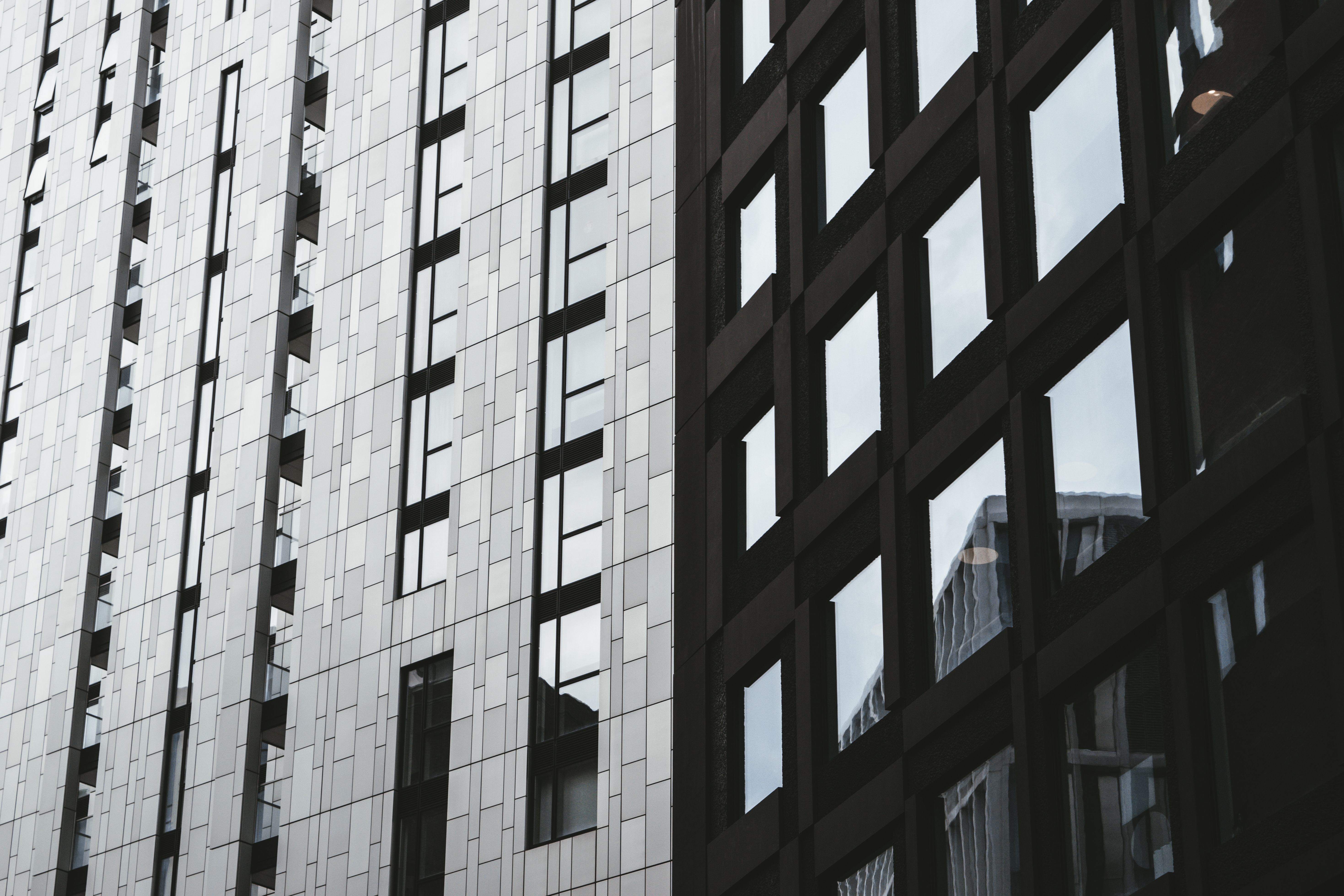 building that's half black half grey symbolizing partial real estate reciprocity