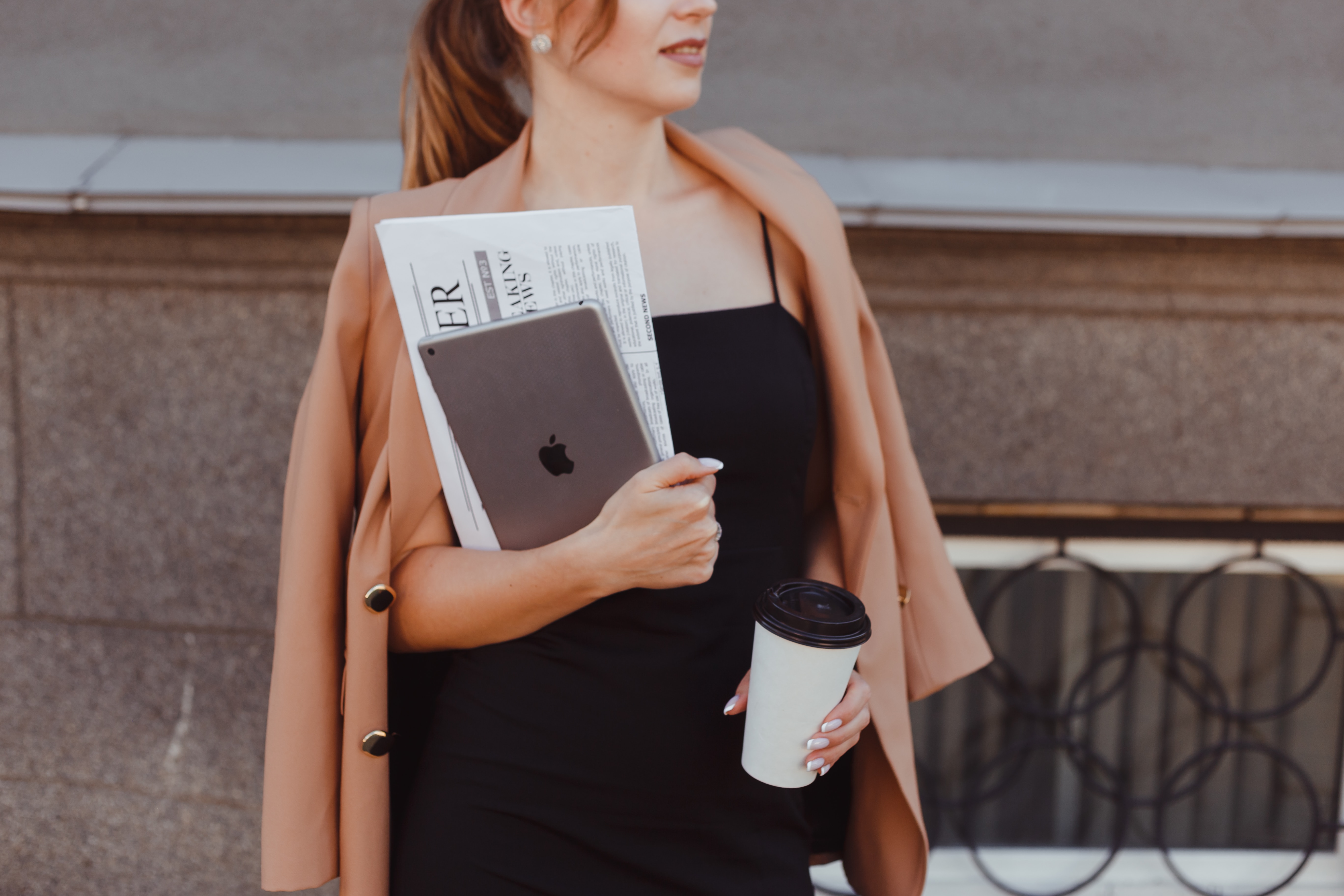 real estate agent holding newspaper