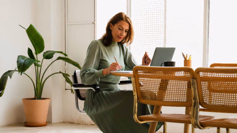 Image of a woman working on a laptop for a blog about Women in Real Estate working on a laptop