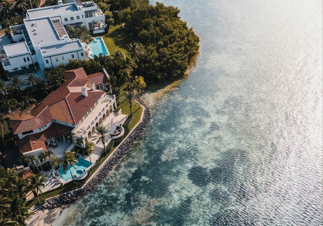 Aerial view of an oceanfront property shot via real estate drone photography