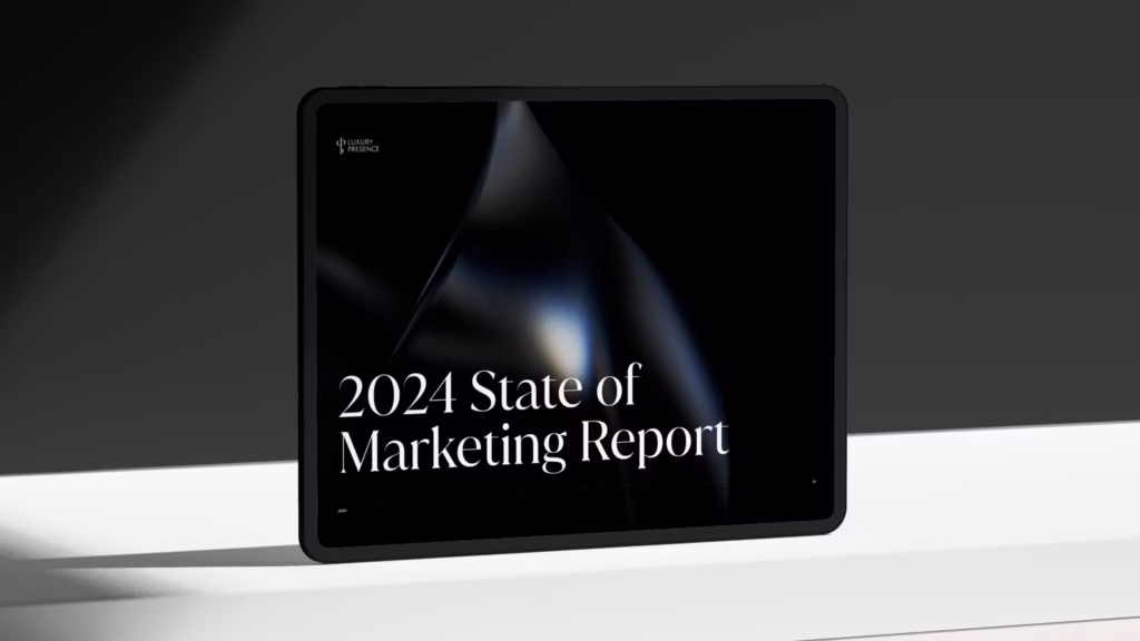 Tablet displaying the 2024 State of Real Estate Marketing report on a white table with a gray background